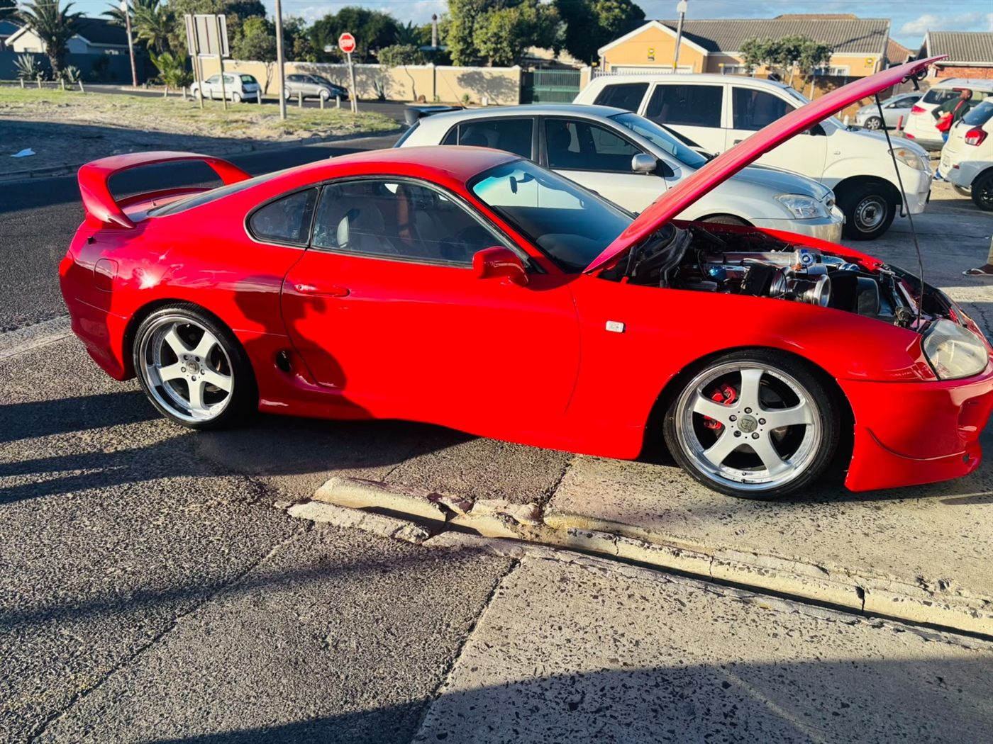 Red Supra outside the workshop