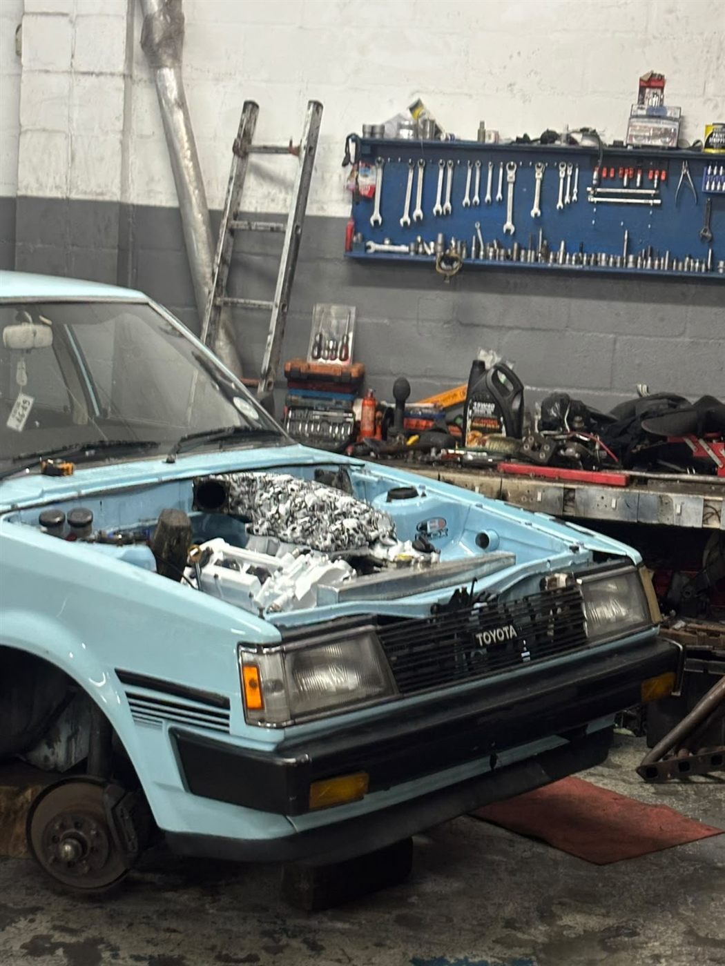 Car in the workshop bay mid-build